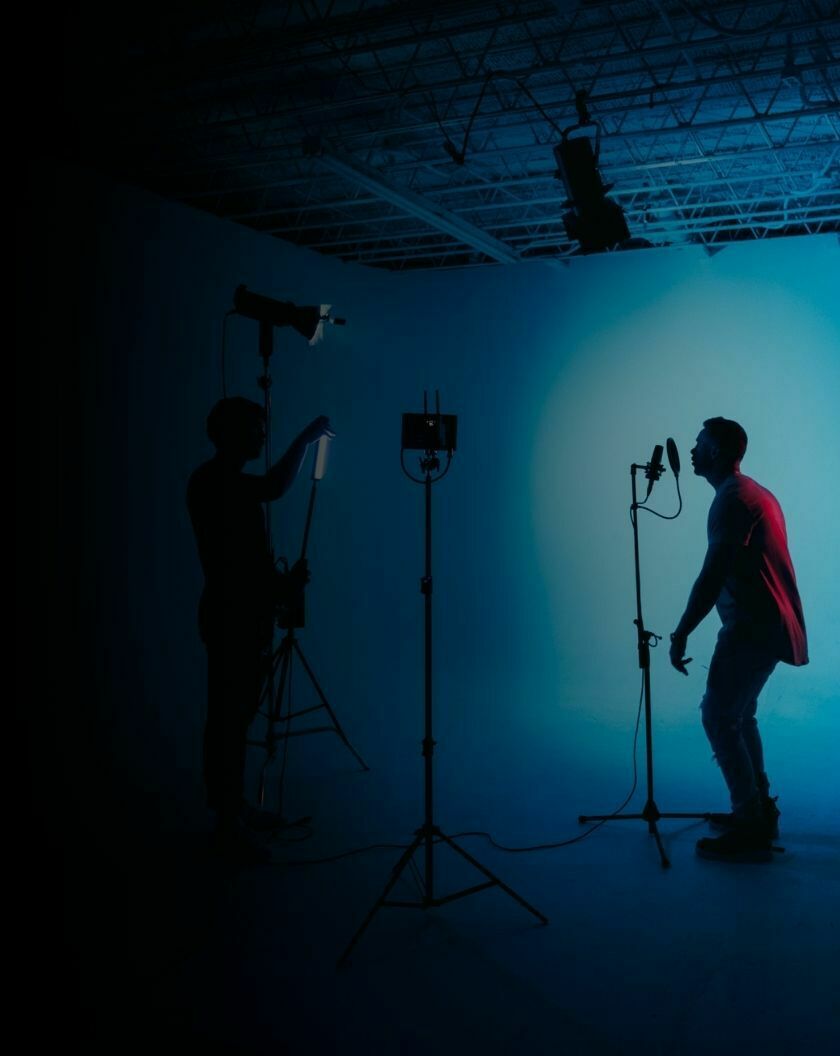 A photography studio where a music production is taking place