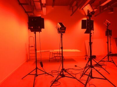 A photography studio with flash light stands